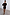 Thumbnail for Black Plisse Mini Tilly Dress with gold metallic dots, an off-the-shoulder neckline and lettuce trims, designed in London.