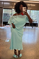 Blue Chiffon Tilly Dress with an off the shoulder neckline and satin skirt, highlighting inclusive sizing in a selfie.
