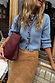 Thumbnail for Ice Blue Studded Cardigan with silver metal studs and structured fit, styled with a suede skirt and burgundy bag.