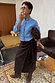 Thumbnail for Ice Blue Studded Cardigan with silver sleeve details, styled with a brown wrap skirt and matching boots.