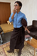 Ice Blue Studded Cardigan with silver sleeve details, styled with a brown wrap skirt and matching boots.