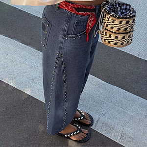 Blue Studded Barrel Jeans in denim with silver side studs, styled with a red bandana and woven bag for a London look.
