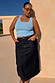 Ice Blue Studded Rib Vest with gold stud neckline detailing, styled with a dark denim skirt for a casual summer look.