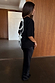 Black Bow Back T-Shirt featuring cream ribbon fastenings and dropped shoulders, styled with a black satin skirt.