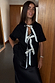 Black cotton t-shirt with cream ribbon bows, styled over a black satin slip dress for a multi-wear look.