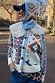 Bridget Cheryl Cardigan in a blue and orange geometric print on cream knit, complete with a detachable wool collar.