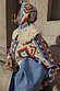 Bridget Cheryl Cardigan with blue and orange geometric motifs and a cream detachable wool collar for multi-wear.