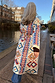 Bridget Maxi Coatigan with blue and orange geometric motifs on a cream base, styled for a London walk by the canal.