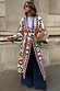Bridget Maxi Coatigan in cream geometric knit with blue and orange tones, tied at the waist over wide-leg jeans.