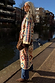 Bridget Maxi Coatigan with blue and orange geometric motifs, belted at the waist for a London look by the canal.
