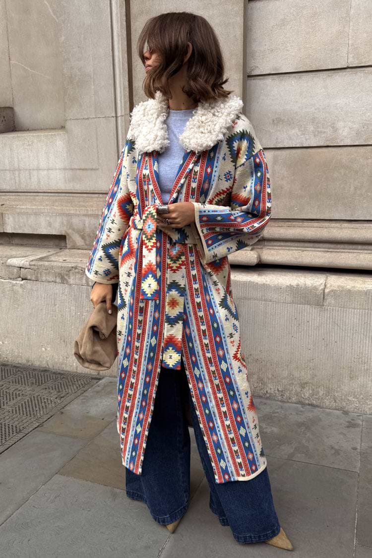 Bridget Maxi Coatigan in a blue and orange geometric print with a detachable white wool collar and belted waist.
