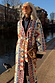 Bridget Maxi Coatigan with blue and orange geometric motifs and a waist tie, styled outdoors by a London canal.