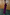 Thumbnail for Burgundy Tilly Dress in textured plissé with gold flecks, styled with an off-the-shoulder neckline.