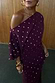 Thumbnail for Burgundy Tilly Dress in textured plisse fabric with gold flecks and an off-the-shoulder neckline.
