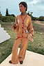 Thumbnail for Camel Wide Leg Joggers with red trim and drawstring, styled with a matching cardigan and leopard print trainers.