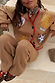 Camel Wide Leg Joggers with red trim and a matching celestial embroidered cardigan on a model.