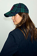 Navy Tartan NFD Cap in blue and green with a red embroidered logo, styled with a pinstripe blazer.