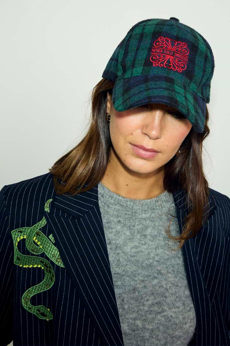 Navy Tartan NFD Cap in blue and green with red embroidered logo, styled with a grey knit and pinstripe blazer.