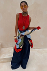 Navy Abstract Callie Cardigan with artist print tied at the waist over a red tank and dark wide-leg jeans.