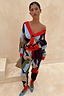 Thumbnail for Navy Abstract Callie Cardigan featuring a bold artist print and red trims, styled with matching trousers as a co-ord.