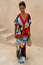 Navy Abstract Callie Cardigan with red trim and artist print, paired with a matching co-ord skirt and clutch.