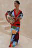 Navy Abstract Callie Cardigan with a colourful artist print and red trim, styled with a matching abstract maxi skirt.
