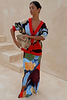 Navy Abstract Callie Cardigan with a colourful artist print and red trim, styled with a matching abstract maxi skirt.