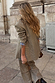 Grey Check Blazer styled with matching trousers for a chic London look, featuring a tailored fit and neutral tones.