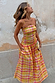 Yellow, pink and orange Check Lola Mid-axi Dress with a ruched bodice, cotton skirt and side pockets on a model.