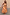 Thumbnail for Check Lola Mid-axi Dress in yellow, pink and orange with a ruched bodice and cotton skirt against a rustic wall.