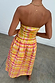 Check Lola Mid-axi Dress in yellow, pink and orange with a ruched bodice and cotton skirt, shown from the back.
