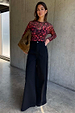 Cherry Mesh Long Sleeve Top featuring a red cherry print, paired with black wide-leg trousers and a suede bag.