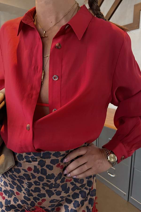 Cherry Red Miley Shirt with blouson sleeves and tortoise buttons, paired with a leopard print skirt.