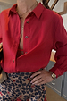Cherry Red Miley Shirt with blouson sleeves and tortoise buttons, paired with a leopard print skirt.