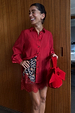 Cherry Red Miley Shirt featuring blouson sleeves and tortoise buttons, styled with a leopard-print lace skirt.
