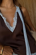 Chocolate Blue Lace Top featuring a deep brown base, light blue lace trim at the V-neckline and multi-wear ties.