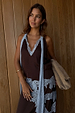 Chocolate brown multi-wear top with blue lace ties and trim, worn as a co-ord with the lace skirt.