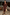 Thumbnail for Chocolate Midi Miley Shirt Dress with a built-in wrap skirt and long sleeves, styled in a neutral indoor setting.