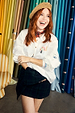 White cotton Choose Love Miley Shirt with heart and eye embroidery, styled with a straw beret and tartan skirt.