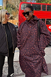Dark Leopard Rain Mac in iconic leopard print with a relaxed fit and front buttons, styled with a red London bus.
