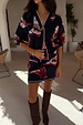 Navy Cowboy Boots Jake knit mini skirt with cowboy motifs and pink trim, styled as a matching co-ord.