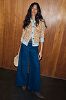 Deer Print Hollie Cardigan featuring a spotted tan pattern and blue trim, styled with dark wide-leg denim jeans.