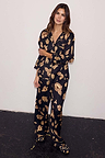 Deloris Button Through Pyjamas in black with gold hand, heart and eye motifs, featuring a button-up shirt and trousers.