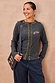 Charcoal Life is Tough Honey drainage bag with multi-coloured text, styled with a matching top and pinstripe trousers.