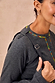 Charcoal Life is Tough Honey Drainage Bag strap worn over a grey ribbed top with vibrant rainbow stitching.