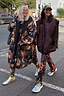 Navy Charm Coat with hand-painted celestial motifs and borg lining, styled as a London look on two women.