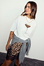 Thumbnail for White cotton Espresso Martini T-Shirt in a boxy fit, styled with a leopard print lace skirt and grey jumper.