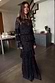 Black Star Devore Felicity Dress in mesh with velvet star motifs and tiered ruffle detailing on a model.