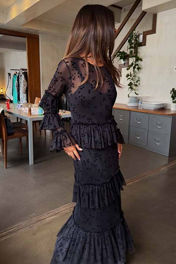 Black Star Devore Felicity Dress in sheer mesh with velvet stars, moon motifs and tiered ruffles, shown on a model.