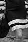 Black and Cream Fringe Jake Skirt in a soft knit with a tiered fringe hem and western-inspired styling.